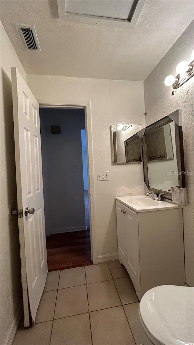 2235 Silver Pines Pl Unit 401, Orlando, FL 32808 - bathroom with vanity, tile patterned floors, toilet, and baseboards