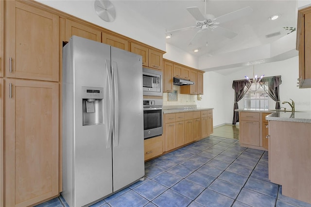 485 Whittingham Pl, Lake Mary, FL 32746 - kitchen with stainless steel appliances, a ceiling fan, under cabinet range hood, dark tile patterned flooring, and light brown cabinets