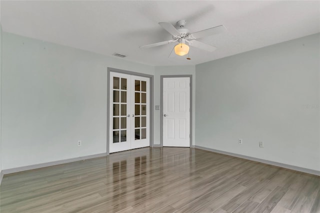 485 Whittingham Pl, Lake Mary, FL 32746 - empty room with french doors, wood finished floors, and ceiling fan