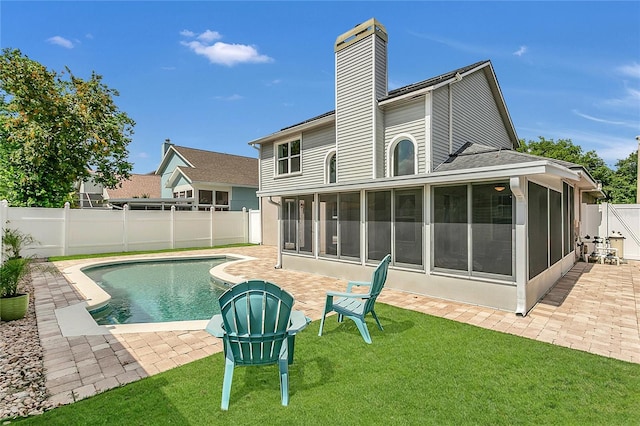 485 Whittingham Pl, Lake Mary, FL 32746 - rear view of property featuring a sunroom, a fenced backyard, a patio, and a chimney