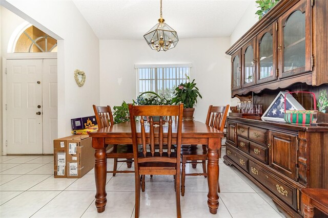 11512 Clair Pl, Clermont, FL 34711 - dining area featuring a chandelier and light tile patterned flooring