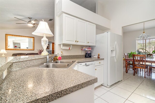 11512 Clair Pl, Clermont, FL 34711 - kitchen with a sink, light tile patterned floors, white appliances, white cabinets, and decorative light fixtures