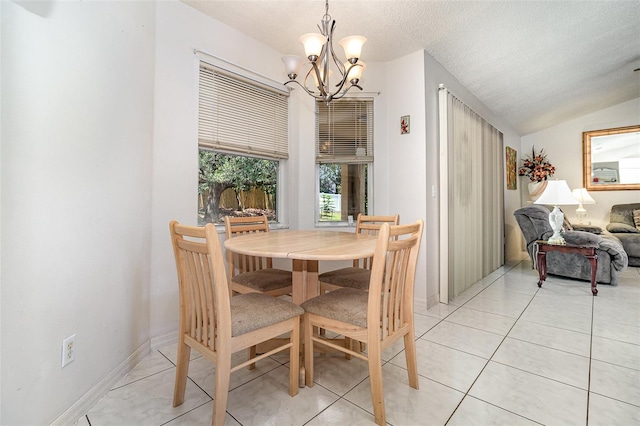 11512 Clair Pl, Clermont, FL 34711 - dining space featuring a chandelier, light tile patterned flooring, a textured ceiling, and lofted ceiling