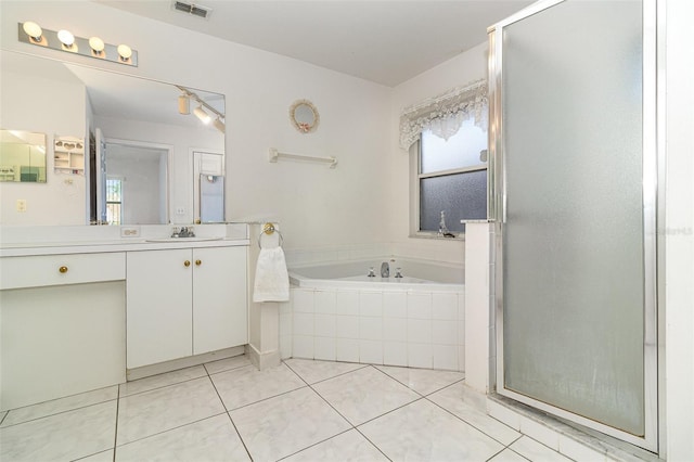 11512 Clair Pl, Clermont, FL 34711 - bathroom featuring vanity, a garden tub, tile patterned floors, and a stall shower