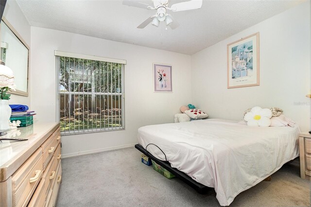 11512 Clair Pl, Clermont, FL 34711 - bedroom featuring light colored carpet, a ceiling fan, and baseboards