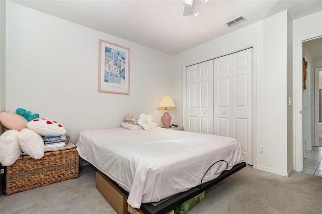 11512 Clair Pl, Clermont, FL 34711 - bedroom with light colored carpet, a closet, a ceiling fan, and baseboards