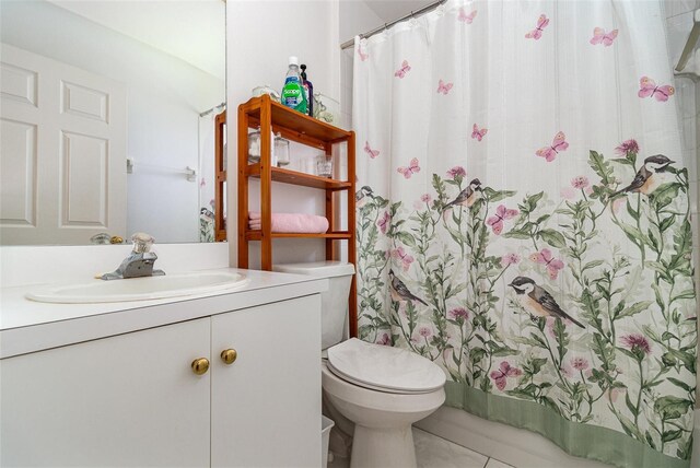 11512 Clair Pl, Clermont, FL 34711 - full bathroom with vanity, toilet, a shower with curtain, and tile patterned flooring
