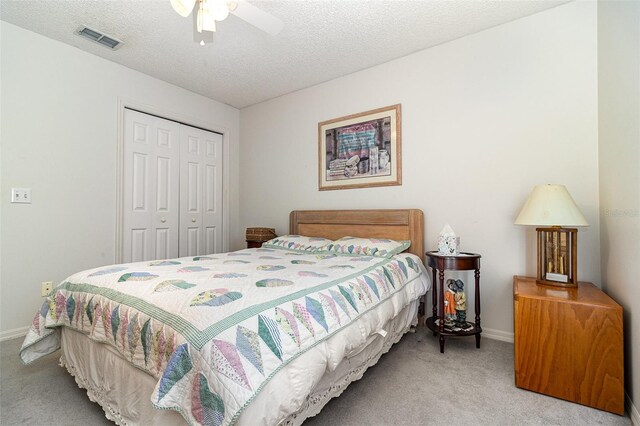 11512 Clair Pl, Clermont, FL 34711 - bedroom featuring carpet flooring, a closet, baseboards, a textured ceiling, and a ceiling fan