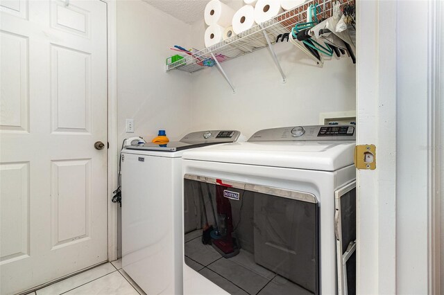 11512 Clair Pl, Clermont, FL 34711 - laundry room with independent washer and dryer and light tile patterned floors