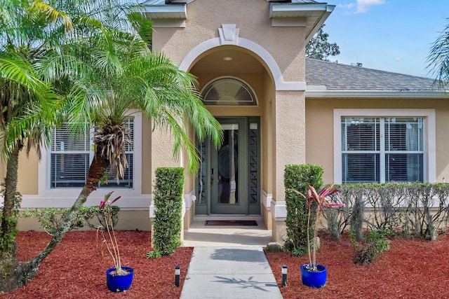 1913 Lazy Oaks Loop, Saint Cloud, FL 34771 - property entrance with stucco siding