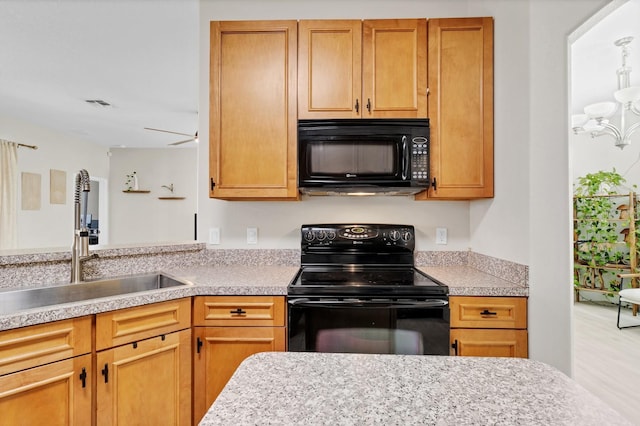 1913 Lazy Oaks Loop, Saint Cloud, FL 34771 - kitchen with black appliances, a sink, light countertops, and a chandelier