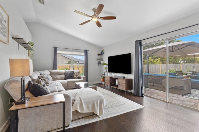 1616 Golden Poppy Ct, Orlando, FL 32824 - living area with a ceiling fan, vaulted ceiling, and wood finished floors