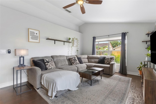 1616 Golden Poppy Ct, Orlando, FL 32824 - living area featuring ceiling fan, dark wood-style flooring, vaulted ceiling, and baseboards