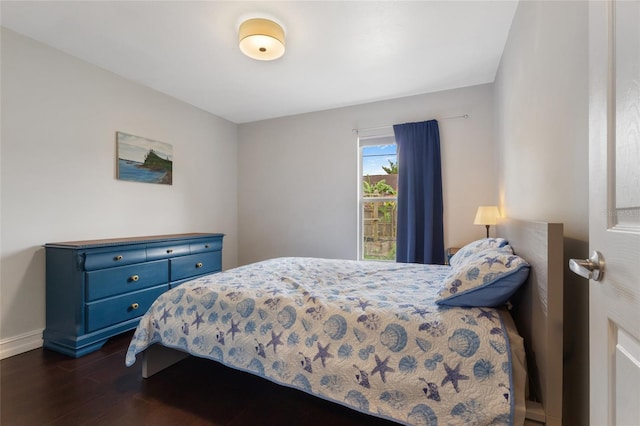 1616 Golden Poppy Ct, Orlando, FL 32824 - bedroom with dark wood finished floors and baseboards