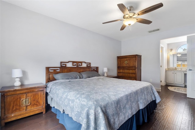 1616 Golden Poppy Ct, Orlando, FL 32824 - bedroom featuring dark wood-type flooring, ceiling fan, and ensuite bathroom