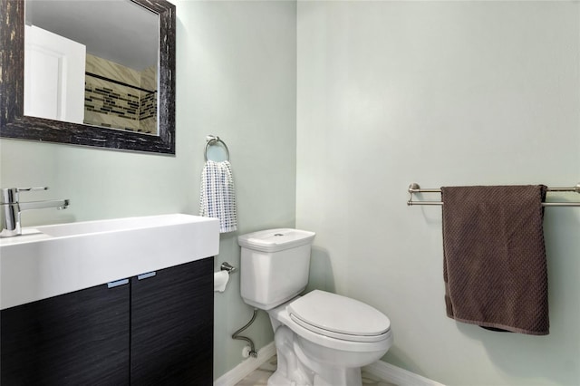 1616 Golden Poppy Ct, Orlando, FL 32824 - bathroom with baseboards, toilet, vanity, and a shower