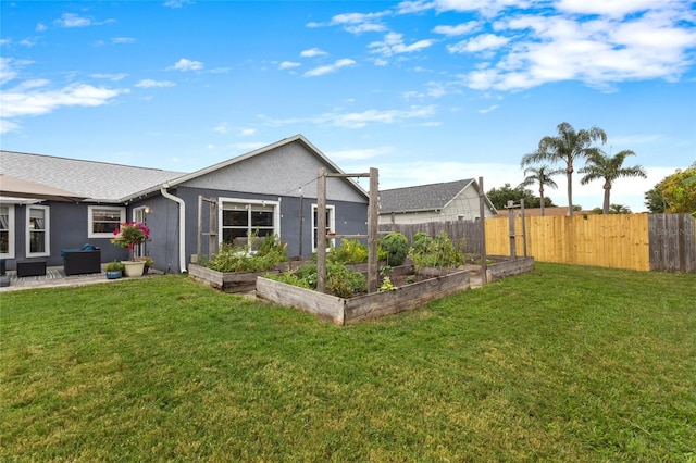 1616 Golden Poppy Ct, Orlando, FL 32824 - back of property featuring a vegetable garden
