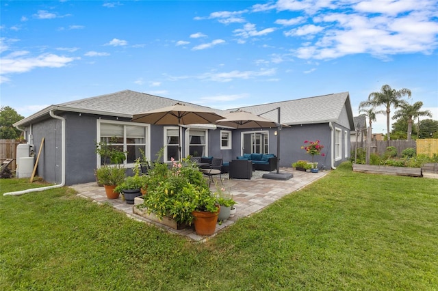 1616 Golden Poppy Ct, Orlando, FL 32824 - rear view of property featuring outdoor lounge area, stucco siding, a patio area, and a garden