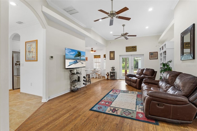 41128 Apple St, Eustis, FL 32736 - living room with a ceiling fan, crown molding, arched walkways, french doors, and recessed lighting