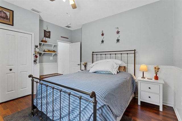 41128 Apple St, Eustis, FL 32736 - bedroom with wood finished floors, wainscoting, a closet, and ceiling fan
