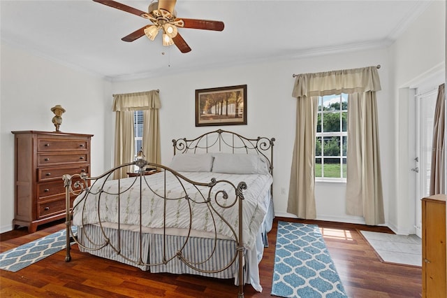 41128 Apple St, Eustis, FL 32736 - bedroom featuring crown molding, wood finished floors, and baseboards