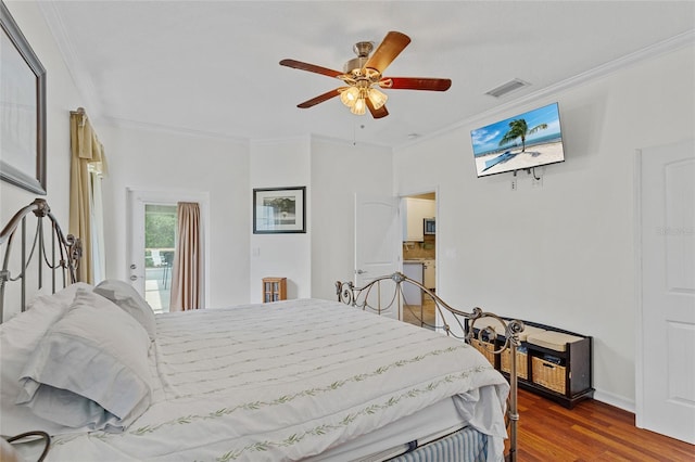 41128 Apple St, Eustis, FL 32736 - bedroom with crown molding, wood finished floors, and a ceiling fan