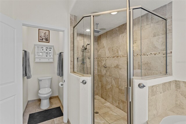 41128 Apple St, Eustis, FL 32736 - full bath with a stall shower, toilet, a bath, and tile patterned floors