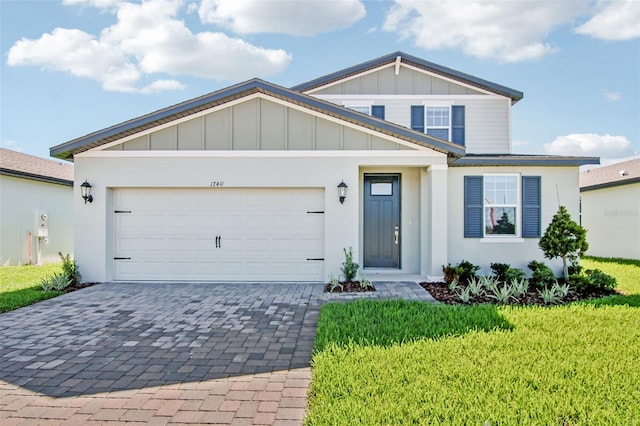 1740 Brekey Way, Zephyrhills, FL 33541 - view of front of house featuring board and batten siding, decorative driveway, a front lawn, and an attached garage