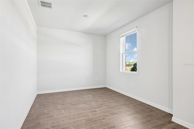 1740 Brekey Way, Zephyrhills, FL 33541 - unfurnished room with wood finished floors and baseboards