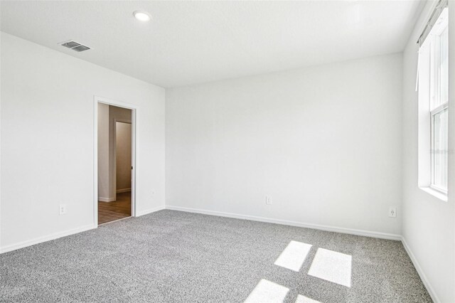 1740 Brekey Way, Zephyrhills, FL 33541 - carpeted spare room featuring baseboards and recessed lighting