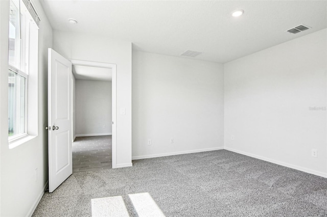 1740 Brekey Way, Zephyrhills, FL 33541 - carpeted spare room featuring recessed lighting and a smoke detector
