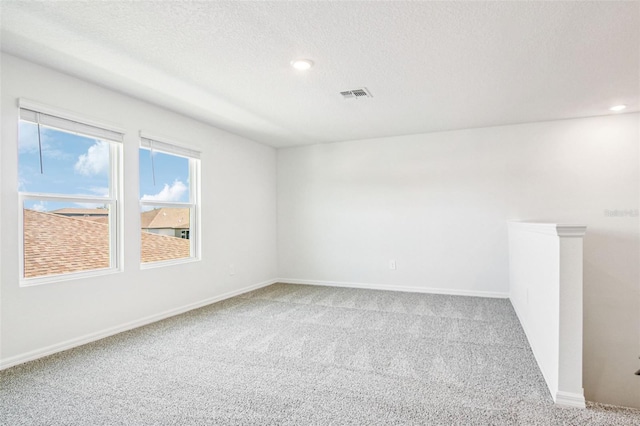 1740 Brekey Way, Zephyrhills, FL 33541 - carpeted empty room featuring recessed lighting and a textured ceiling