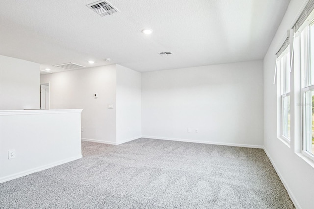 1740 Brekey Way, Zephyrhills, FL 33541 - empty room featuring carpet flooring, healthy amount of natural light, and recessed lighting