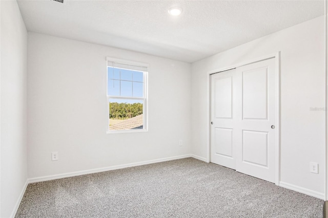 1740 Brekey Way, Zephyrhills, FL 33541 - unfurnished bedroom featuring carpet flooring and baseboards