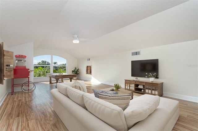 6121 Oxbow Bend Ln, Port Orange, FL 32128 - living room featuring lofted ceiling, baseboards, wood finished floors, and ceiling fan