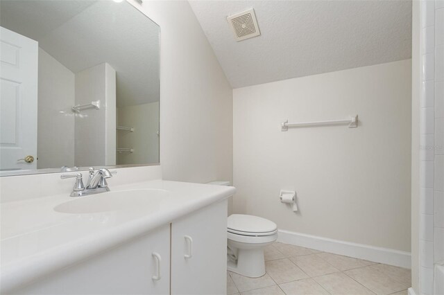 6121 Oxbow Bend Ln, Port Orange, FL 32128 - full bath with toilet, vanity, tile patterned flooring, lofted ceiling, and a shower