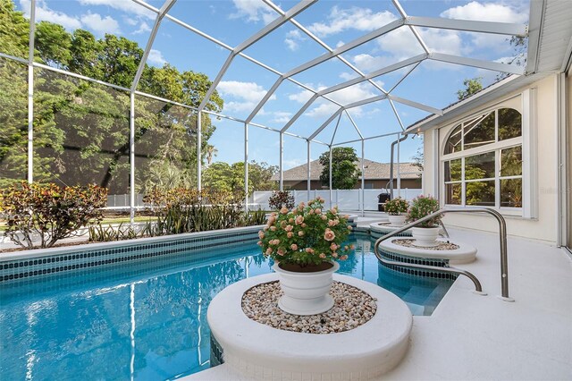 6121 Oxbow Bend Ln, Port Orange, FL 32128 - view of swimming pool with a patio area and glass enclosure