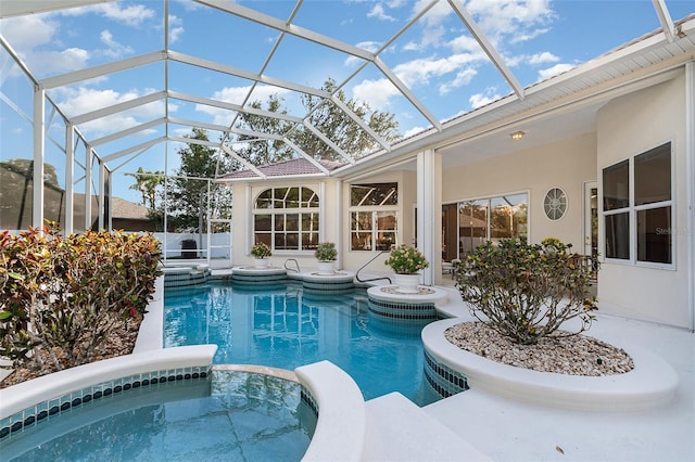 6121 Oxbow Bend Ln, Port Orange, FL 32128 - view of pool with a pool with connected hot tub, a patio area, and a lanai
