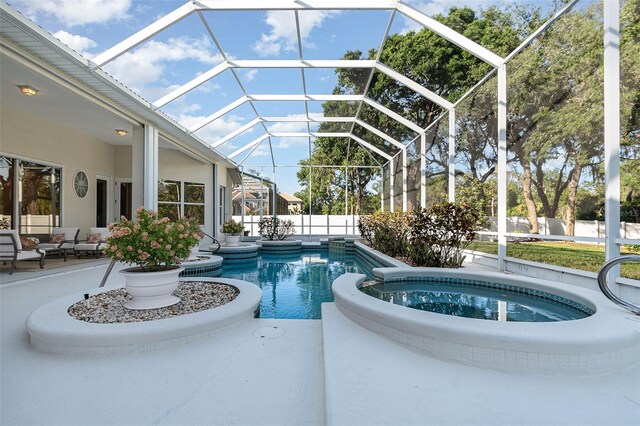 6121 Oxbow Bend Ln, Port Orange, FL 32128 - view of pool featuring a patio, a pool with connected hot tub, glass enclosure, and an outdoor hangout area