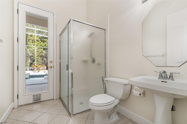 6121 Oxbow Bend Ln, Port Orange, FL 32128 - full bathroom featuring a shower stall, toilet, tile patterned floors, and baseboards