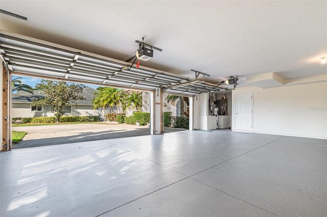 6121 Oxbow Bend Ln, Port Orange, FL 32128 - garage featuring a garage door opener and heating unit