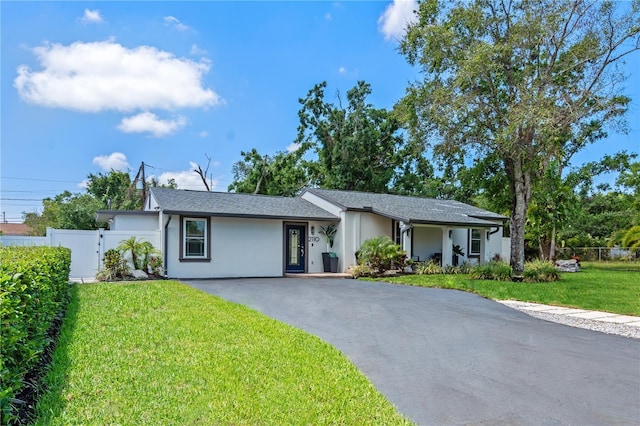 2110 W Farwell Dr, Tampa, FL 33603 - view of front of property with stucco siding and driveway
