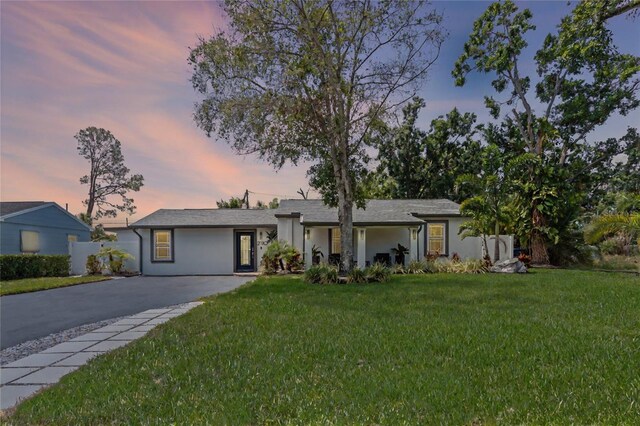 2110 W Farwell Dr, Tampa, FL 33603 - view of front of house featuring stucco siding and driveway