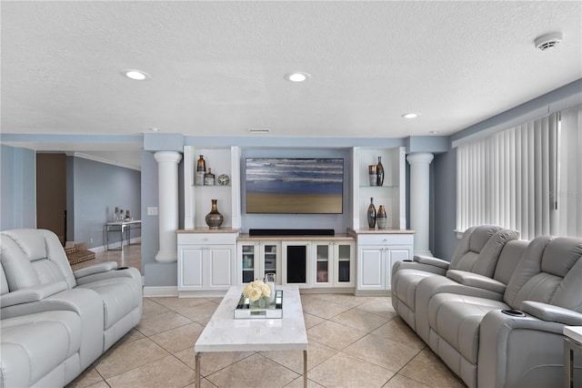 2110 W Farwell Dr, Tampa, FL 33603 - living room featuring a textured ceiling, light tile patterned floors, ornate columns, recessed lighting, and baseboards