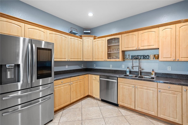 2110 W Farwell Dr, Tampa, FL 33603 - kitchen with stainless steel appliances, a sink, light brown cabinetry, light tile patterned floors, and recessed lighting