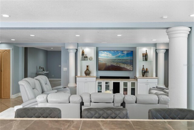 2110 W Farwell Dr, Tampa, FL 33603 - living area featuring ornate columns, light tile patterned floors, baseboards, and recessed lighting