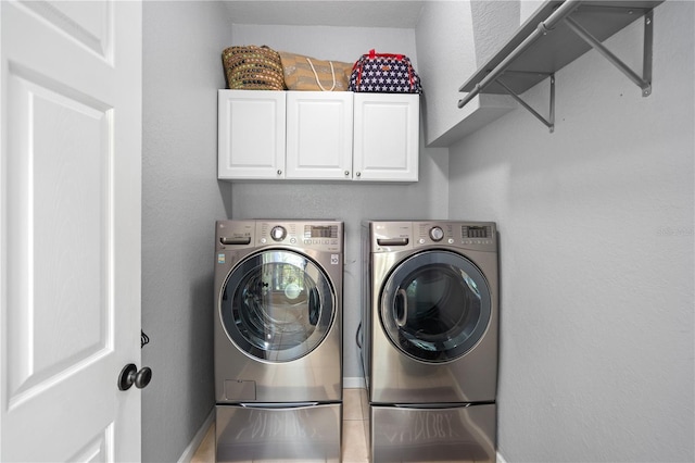 2110 W Farwell Dr, Tampa, FL 33603 - laundry room featuring separate washer and dryer and cabinet space