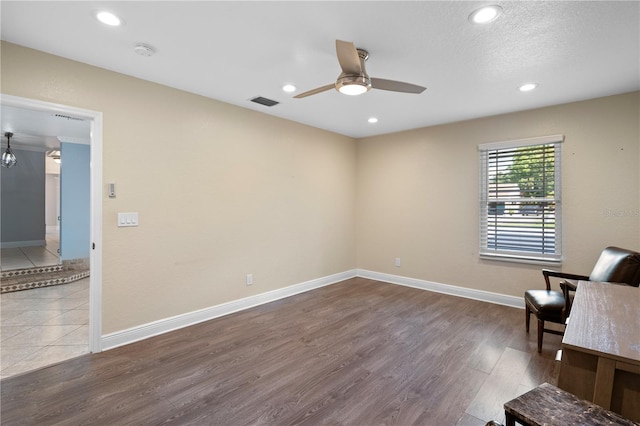 2110 W Farwell Dr, Tampa, FL 33603 - unfurnished room featuring a ceiling fan, wood finished floors, recessed lighting, and baseboards