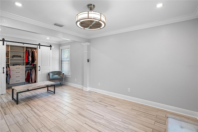 2110 W Farwell Dr, Tampa, FL 33603 - workout room featuring a barn door, baseboards, light wood-style floors, crown molding, and recessed lighting