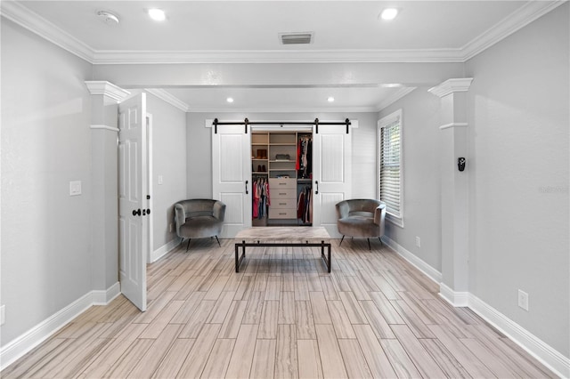 2110 W Farwell Dr, Tampa, FL 33603 - sitting room with a barn door, light wood finished floors, baseboards, recessed lighting, and ornamental molding